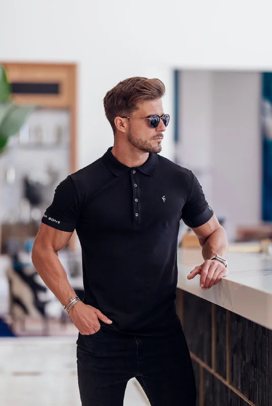 versatile short sleeve shirts for weekend trips -Father Sons Classic Black Polo with FS Elastic Sleeve Branding and Black Metal Emblem - FSH631